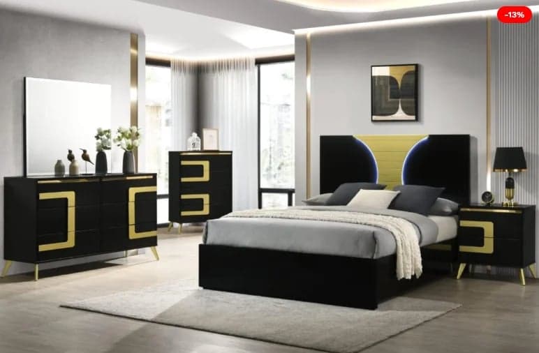 Modern bedroom set with black and gold furniture including bed, nightstands, dresser, and mirror in contemporary home interior