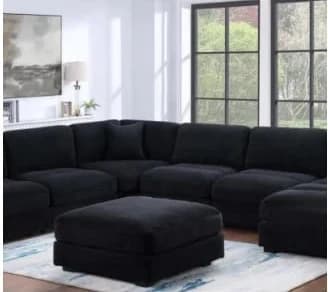 Black modular sectional sofa L121 Violet in living room with ottoman, 36% off sale price $1,599